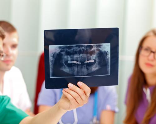 Dentists examining x-ray